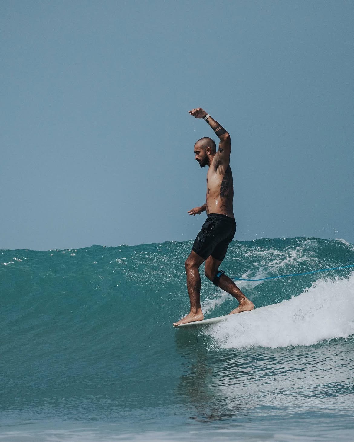 Anton riding a longboard